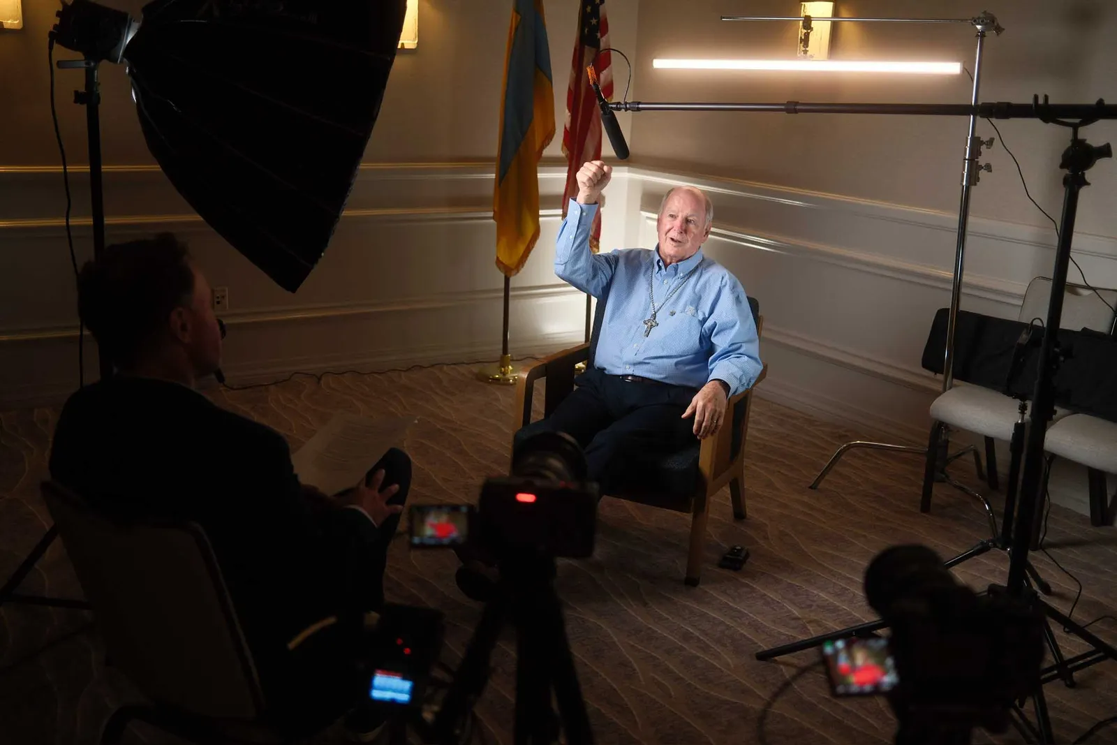 A gentle single camera interview set with warm light